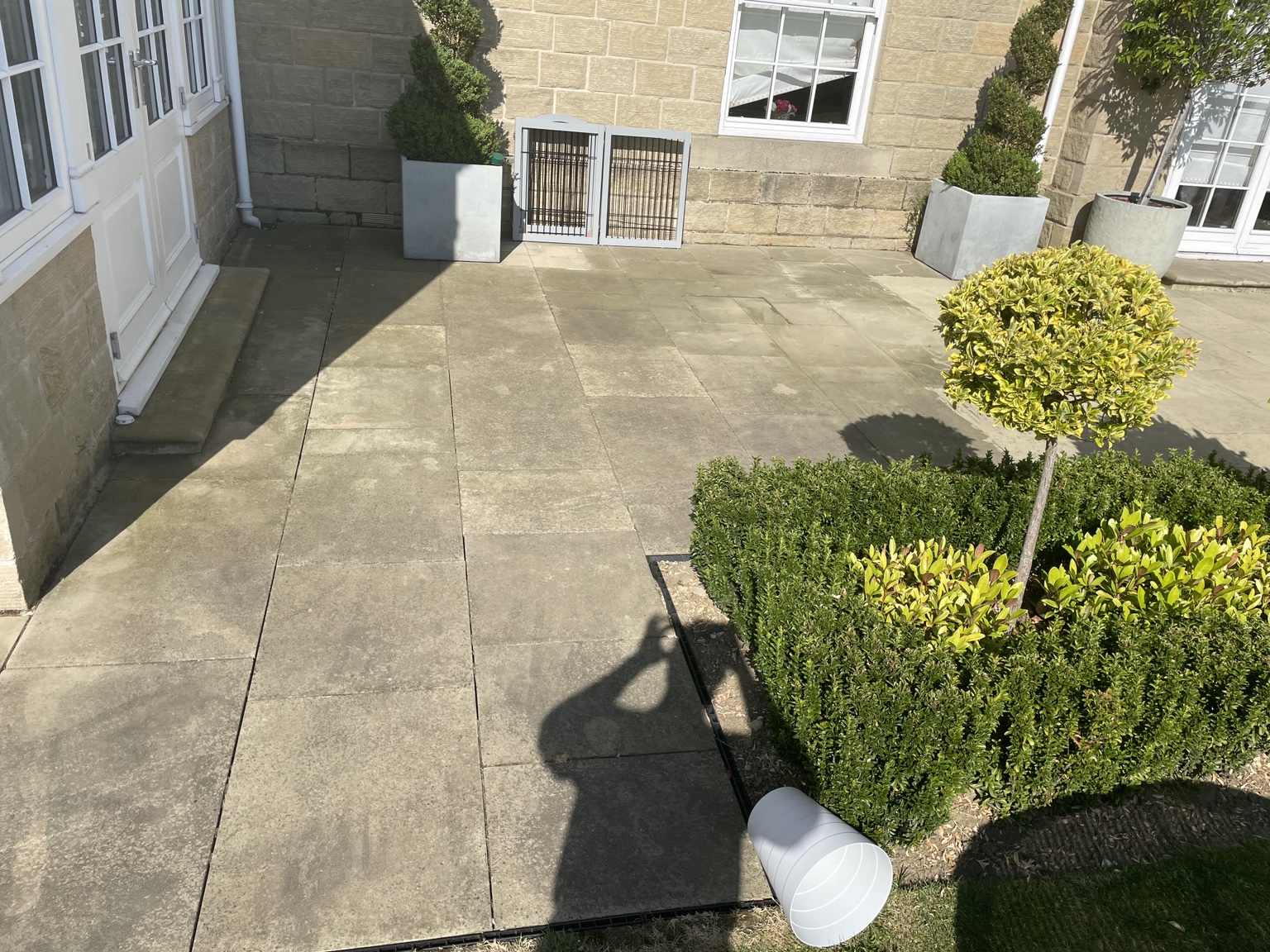 Before · A brighter stone patio