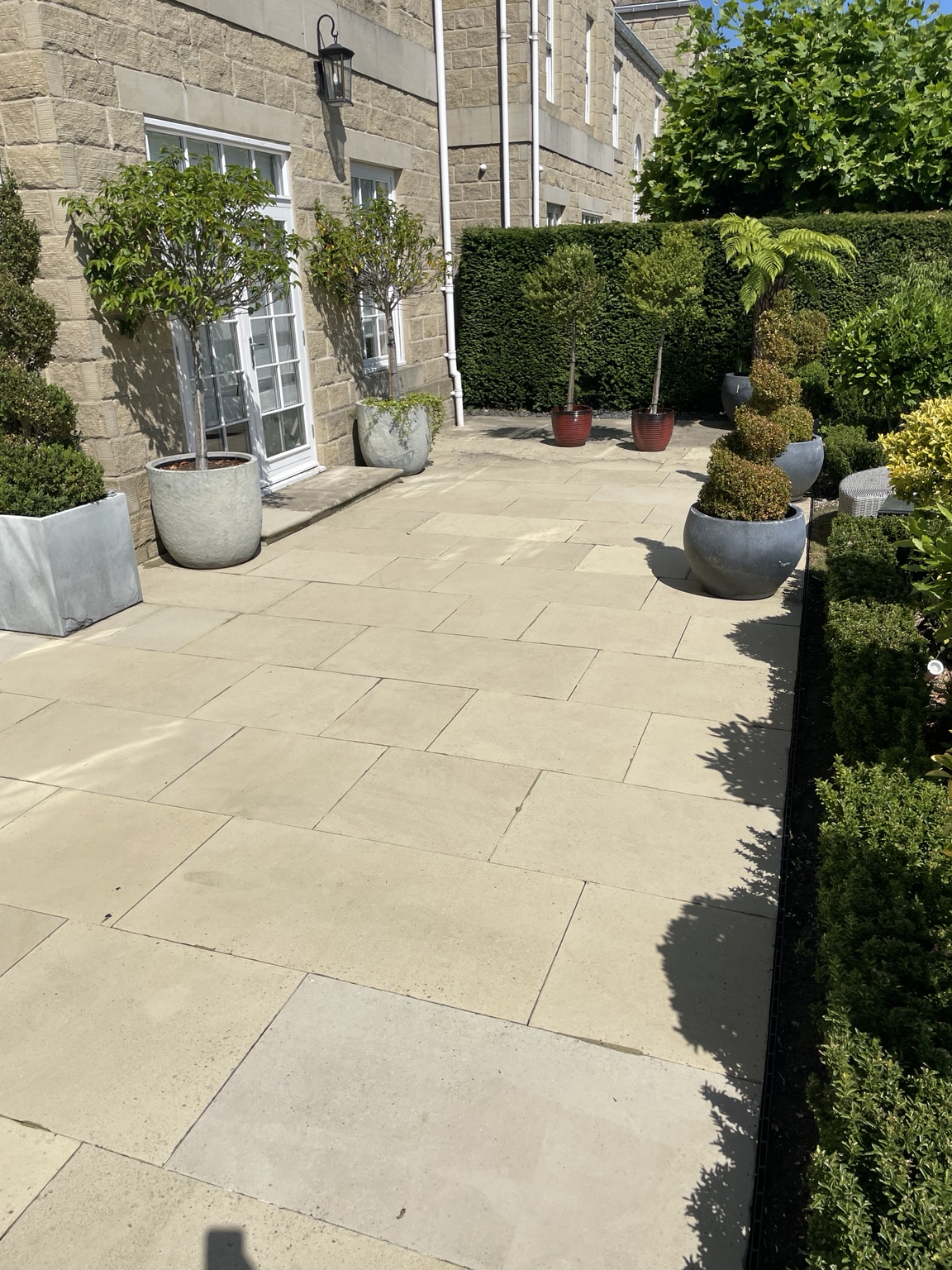 After · A brighter stone patio