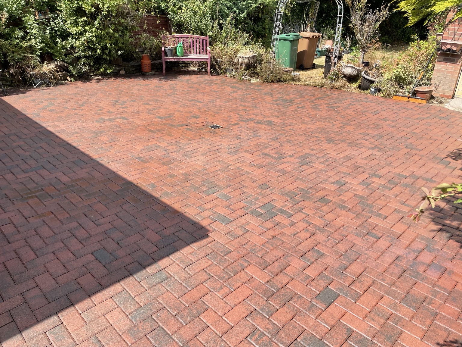 After · Overgrown block paving brought back